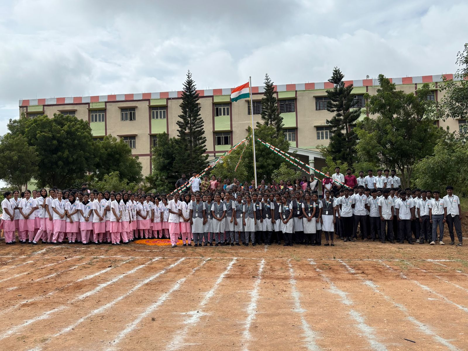 Students assembled in front of the college building